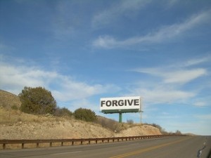 billboard sign with words "Forgive"