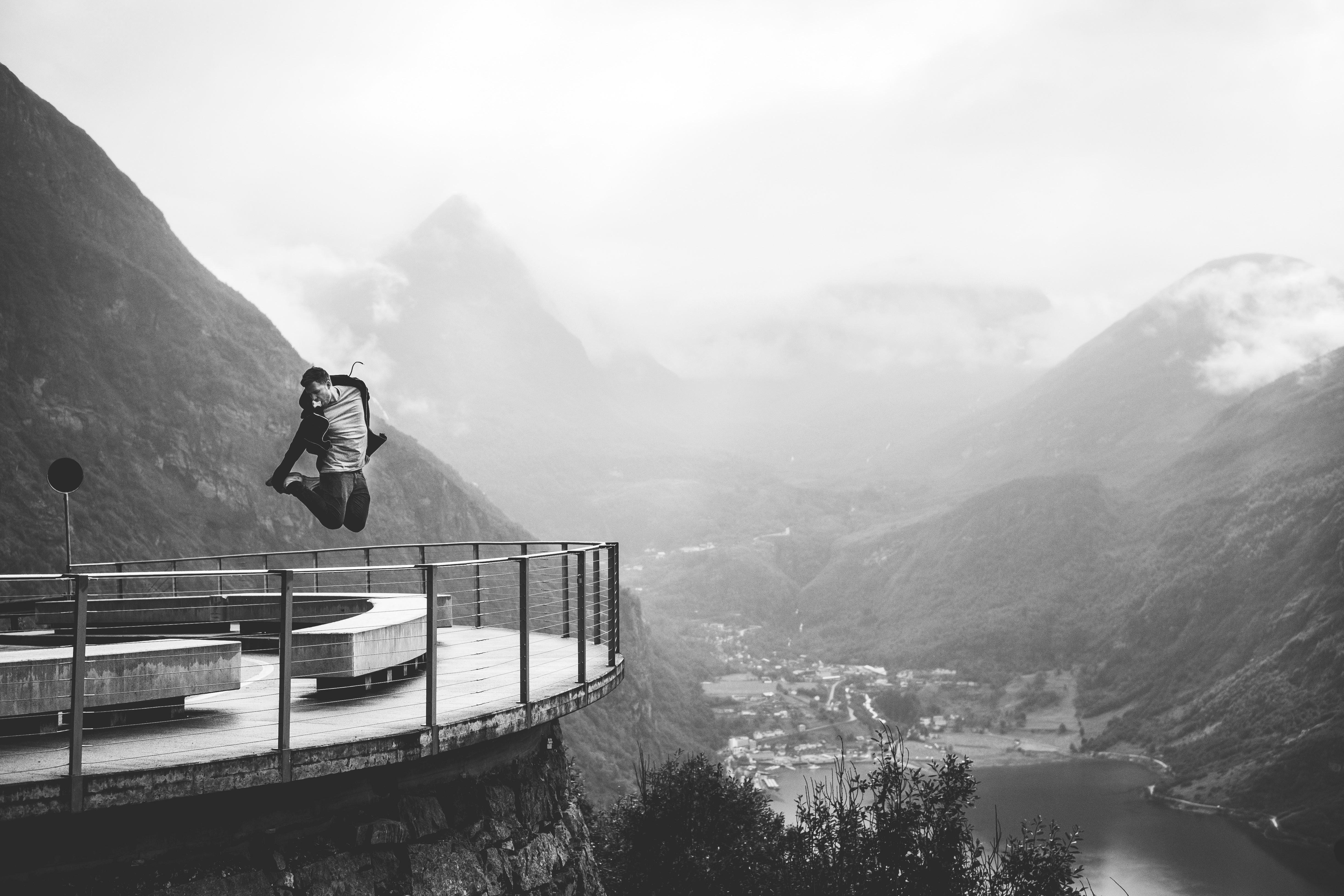 image of a man jumping off a cliff