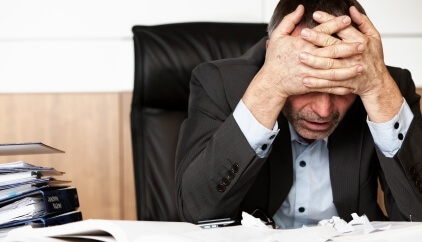 Picture of a man stressed at work