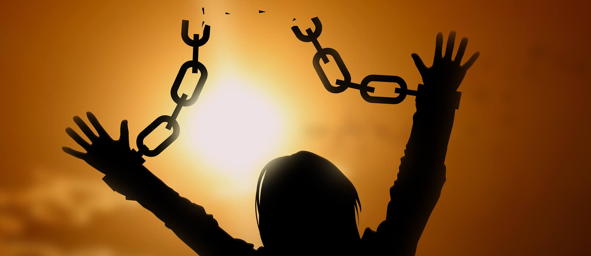 a woman breaking free from chains